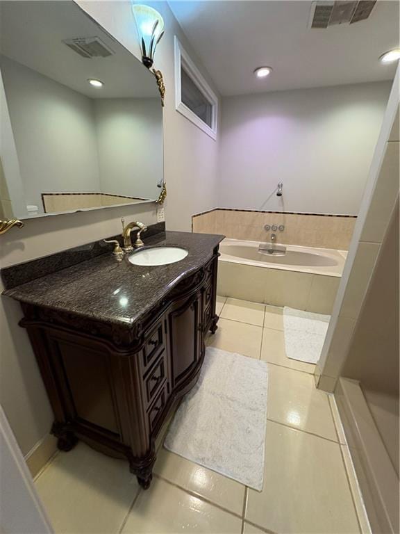 2807 Mcclave Dr, Doraville, GA 30340 - full bath featuring a garden tub, vanity, and tile patterned flooring