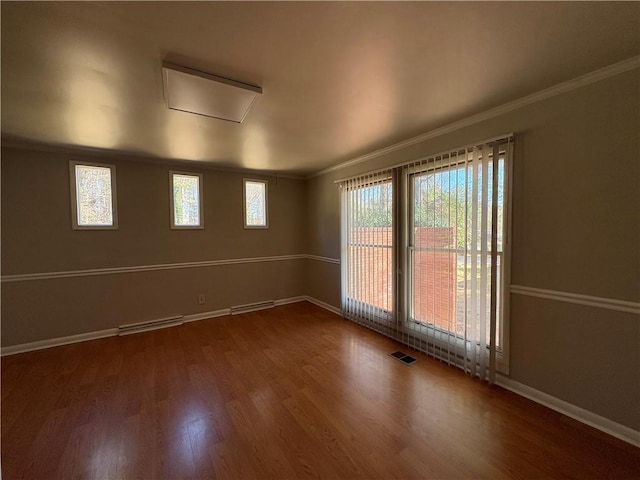 2807 Mcclave Dr, Doraville, GA 30340 - spare room with ornamental molding, wood finished floors, and baseboards