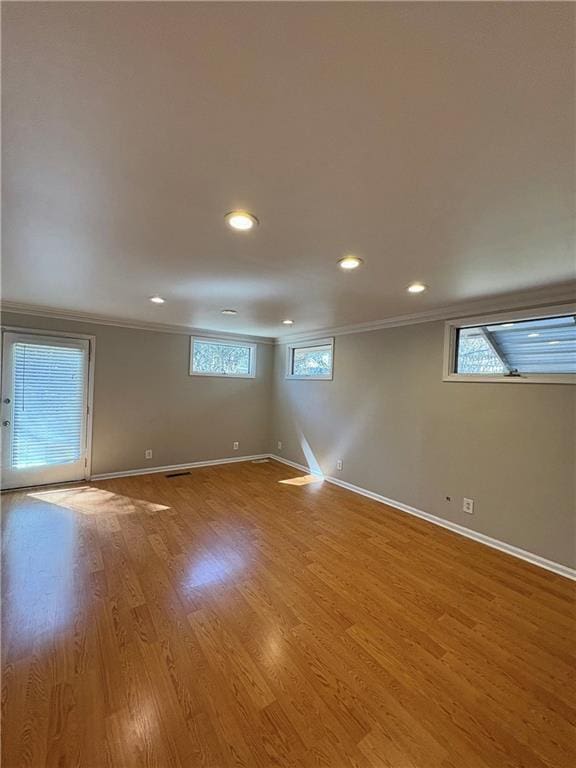 2807 Mcclave Dr, Doraville, GA 30340 - empty room with crown molding, baseboards, recessed lighting, and wood finished floors