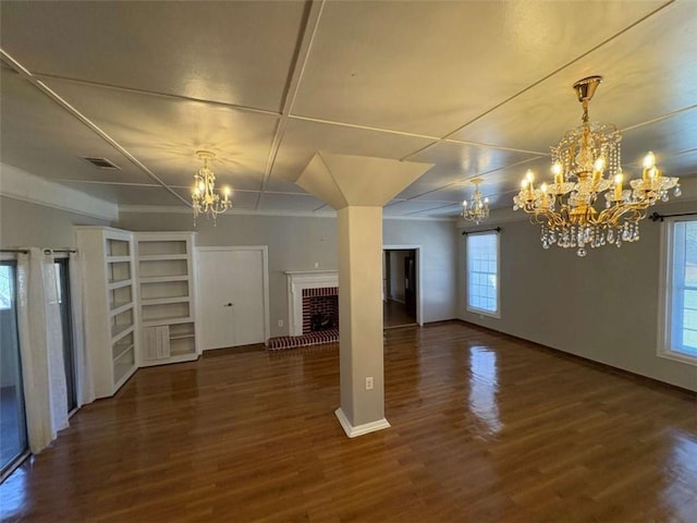 2807 Mcclave Dr, Doraville, GA 30340 - unfurnished dining area featuring a chandelier, wood finished floors, a brick fireplace, and baseboards