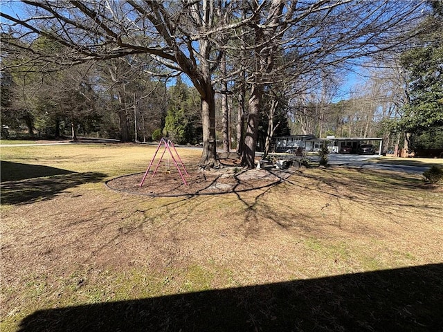 2807 Mcclave Dr, Doraville, GA 30340 - view of yard featuring a detached carport and driveway