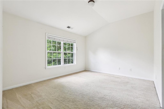 626 Pecan Knoll Dr Unit 13, Marietta, GA 30008 - spare room featuring carpet flooring and vaulted ceiling