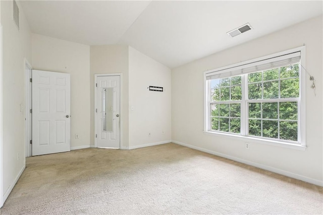 626 Pecan Knoll Dr Unit 13, Marietta, GA 30008 - unfurnished bedroom featuring light carpet and vaulted ceiling