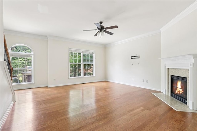 626 Pecan Knoll Dr Unit 13, Marietta, GA 30008 - unfurnished living room with a fireplace, wood finished floors, a ceiling fan, and crown molding