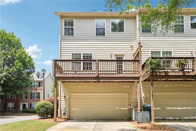 626 Pecan Knoll Dr Unit 13, Marietta, GA 30008 - rear view of house with a garage and driveway