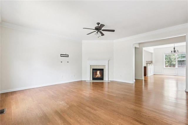 626 Pecan Knoll Dr Unit 13, Marietta, GA 30008 - unfurnished living room with wood finished floors, ornamental molding, a ceiling fan, a chandelier, and a fireplace with flush hearth