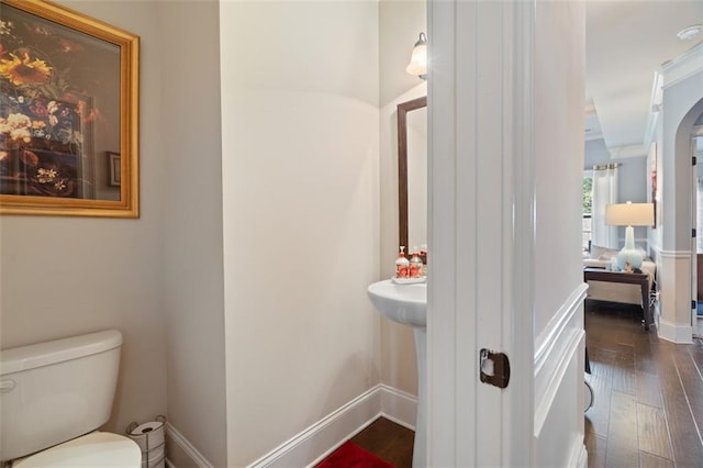 bathroom featuring hardwood / wood-style floors and toilet