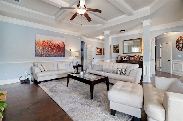 living room with hardwood / wood-style flooring, beam ceiling, decorative columns, and crown molding