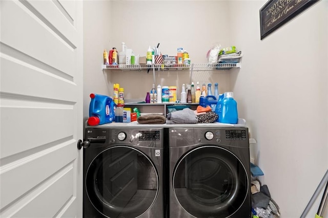 laundry room with washing machine and clothes dryer