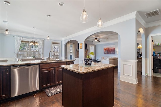 kitchen featuring a kitchen island, pendant lighting, dark brown cabinets, and stainless steel dishwasher