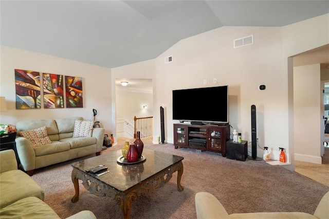 carpeted living room with vaulted ceiling