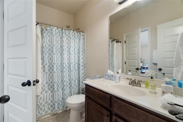 bathroom with tile patterned flooring, vanity, toilet, and a shower with curtain