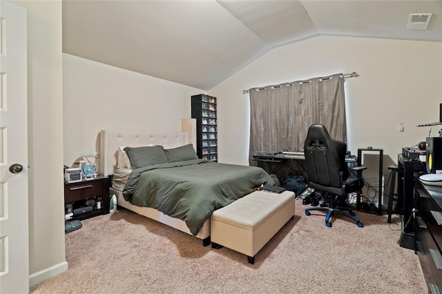 bedroom with vaulted ceiling and carpet