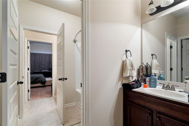 bathroom with vanity, tub / shower combination, and tile patterned flooring