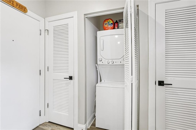 840 United Ave SE Unit 205, Atlanta, GA 30312 - laundry room with stacked washer / drying machine and wood finished floors
