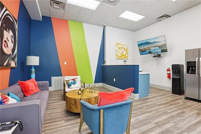 840 United Ave SE Unit 205, Atlanta, GA 30312 - living area with wood finished floors and a drop ceiling