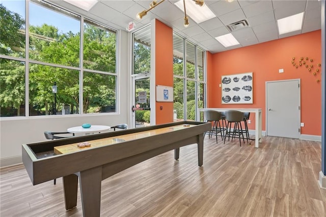840 United Ave SE Unit 205, Atlanta, GA 30312 - rec room with a paneled ceiling, wood finished floors, and a wall of windows