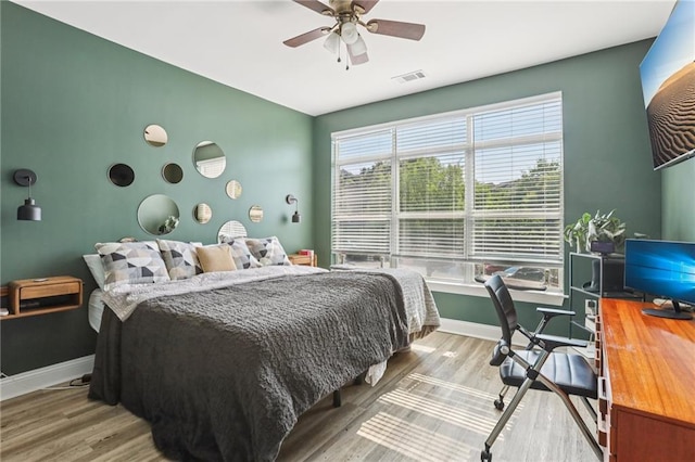 840 United Ave SE Unit 205, Atlanta, GA 30312 - bedroom with a desk, wood finished floors, and ceiling fan