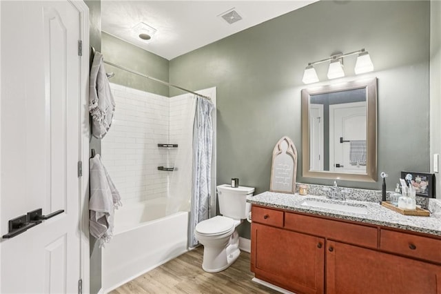 840 United Ave SE Unit 205, Atlanta, GA 30312 - bathroom with vanity, shower / bathtub combination with curtain, and wood finished floors