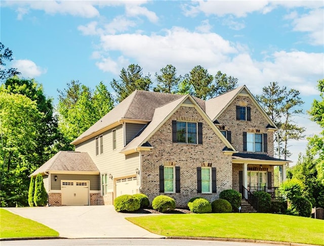 craftsman-style house featuring brick siding, a front yard, concrete driveway, and an attached garage