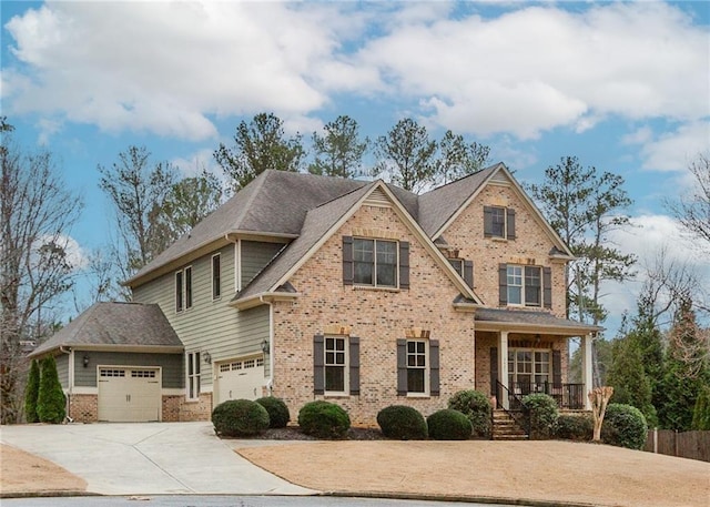 view of front of property with a garage, covered porch, brick siding, and driveway