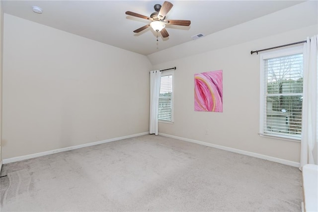 unfurnished room with carpet flooring, a ceiling fan, and baseboards