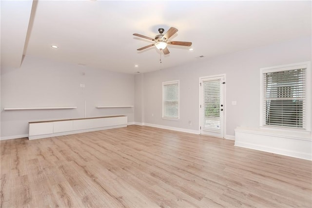 empty room with light wood-style floors, ceiling fan, recessed lighting, and baseboards
