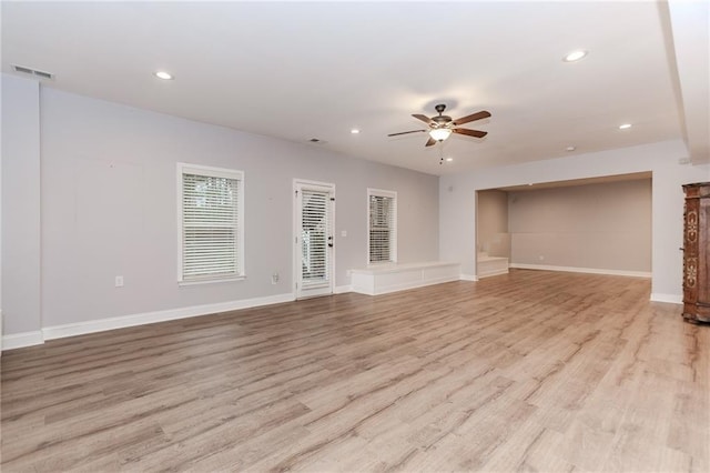 unfurnished living room featuring ceiling fan, recessed lighting, light wood-style flooring, and baseboards
