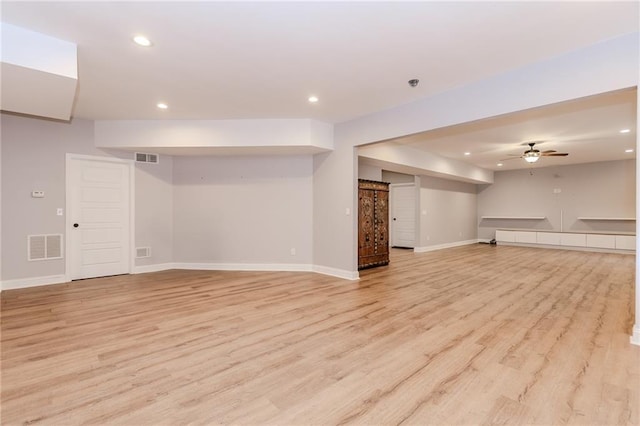 finished below grade area with recessed lighting, light wood-style flooring, baseboards, and ceiling fan
