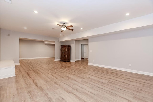 unfurnished living room with recessed lighting, ceiling fan, light wood-style floors, and baseboards
