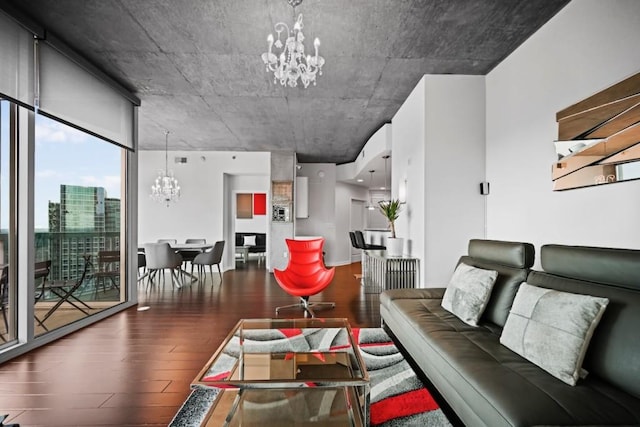 living room featuring a notable chandelier and wood finished floors