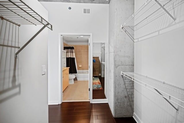 spacious closet with wood finished floors and visible vents