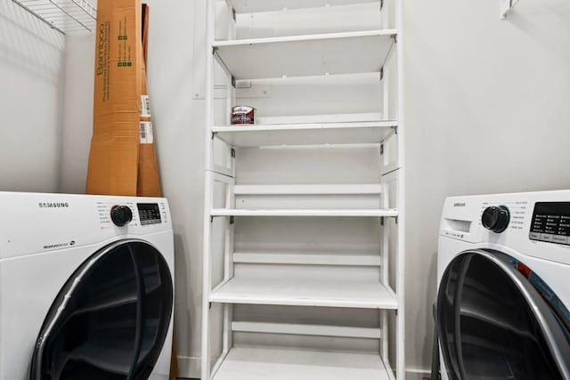 clothes washing area with washer / clothes dryer