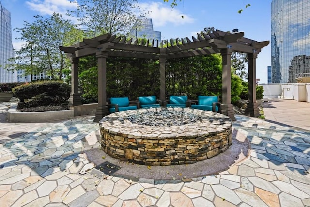 view of patio / terrace featuring an outdoor living space with a fire pit