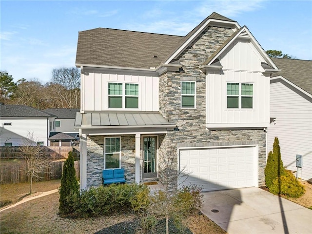 view of front of property with stone siding, board and batten siding, and concrete driveway