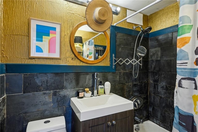 full bathroom with vanity, toilet, shower / tub combo, and tile walls