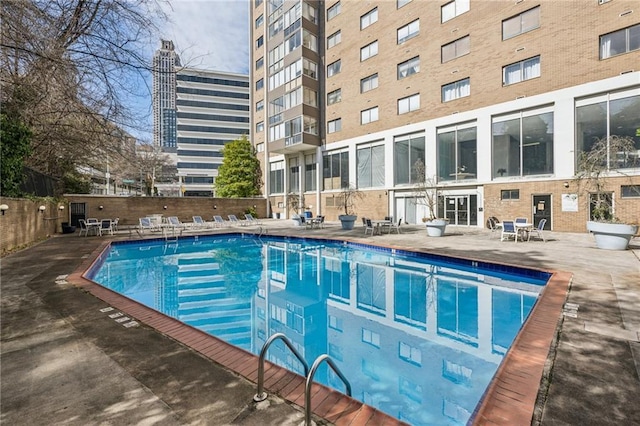 view of swimming pool with a patio