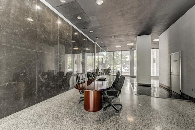 dining space featuring expansive windows