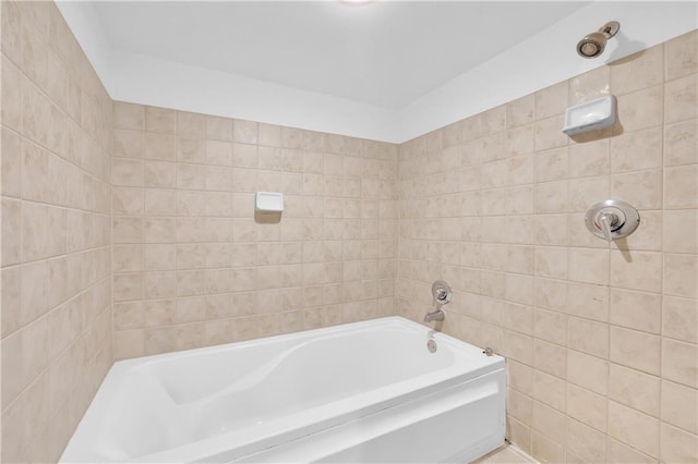 572 Edgewood Ave NE Unit 309, Atlanta, GA 30312 - bathroom with a tub and tile walls