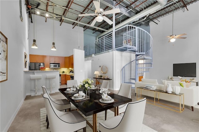 572 Edgewood Ave NE Unit 309, Atlanta, GA 30312 - dining area with ceiling fan and a high ceiling