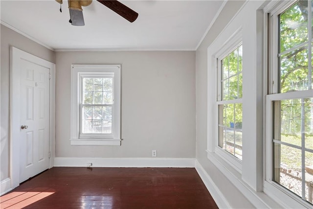 empty room featuring baseboards and dark wood-style flooring