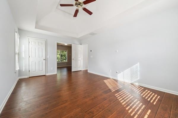 3272 Monarch Pine Dr, Peachtree Corners, GA 30071 - unfurnished living room with ceiling fan, a raised ceiling, and wood finished floors