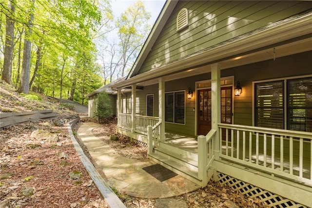 view of side of property with covered porch