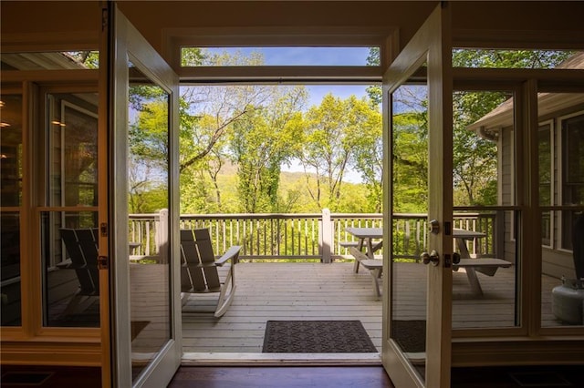 doorway to outside featuring french doors and dark hardwood / wood-style flooring