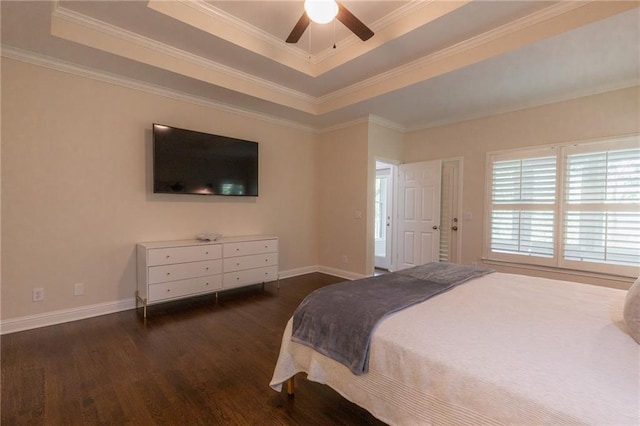 bedroom with ceiling fan, dark hardwood / wood-style floors, a raised ceiling, and crown molding