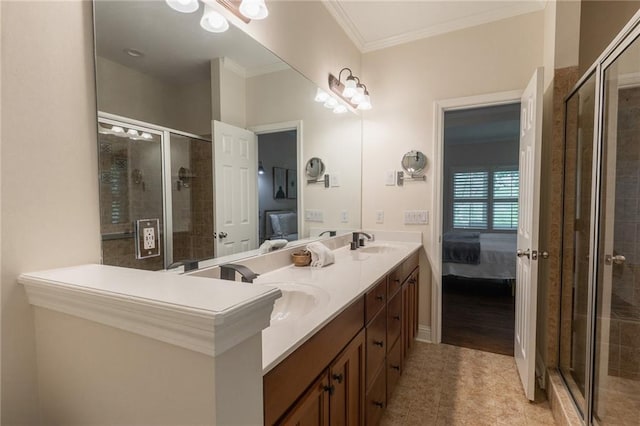 bathroom with tile patterned floors, crown molding, vanity, and a shower with shower door