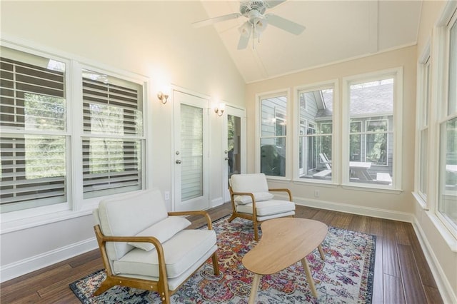 sunroom / solarium with ceiling fan, a healthy amount of sunlight, and lofted ceiling