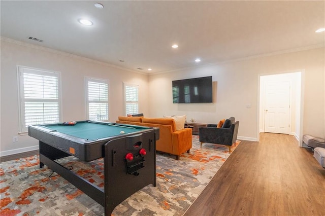 game room with hardwood / wood-style floors, ornamental molding, and pool table