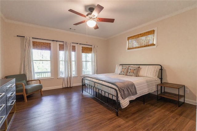 bedroom with ceiling fan, dark hardwood / wood-style flooring, and ornamental molding