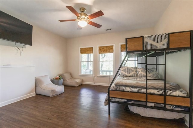 bedroom featuring ceiling fan and dark wood-type flooring